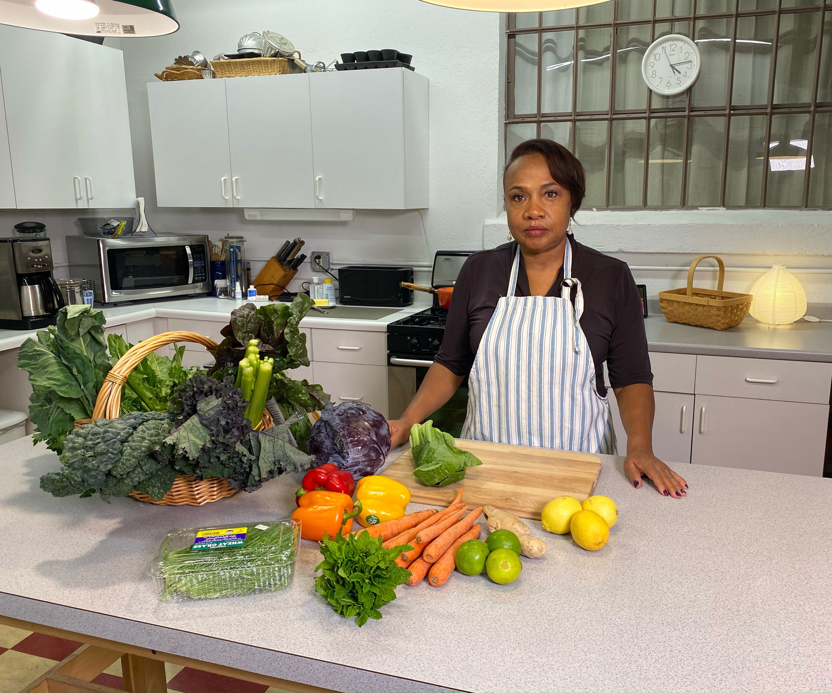Dr. Yvette Whitton with fresh vegetables during a nutrition demonstration